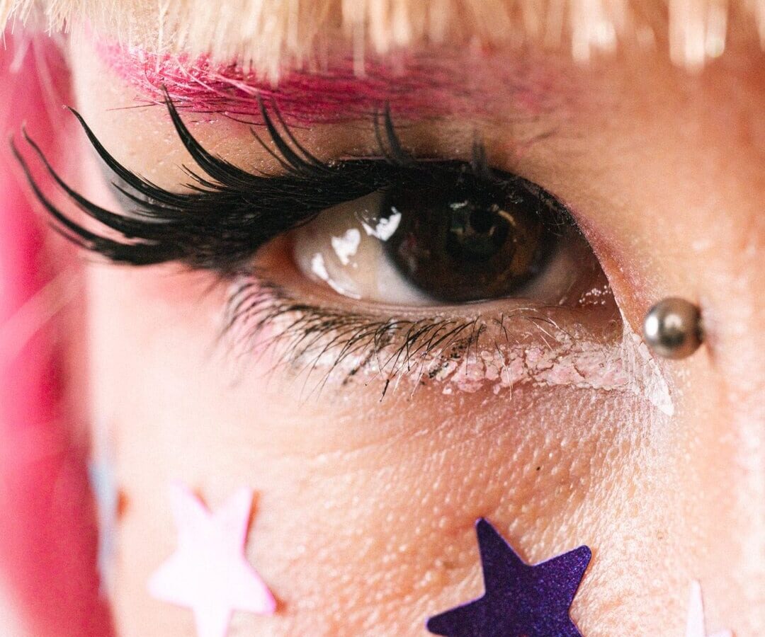 Close-up alternative portrait with stars painted on the face