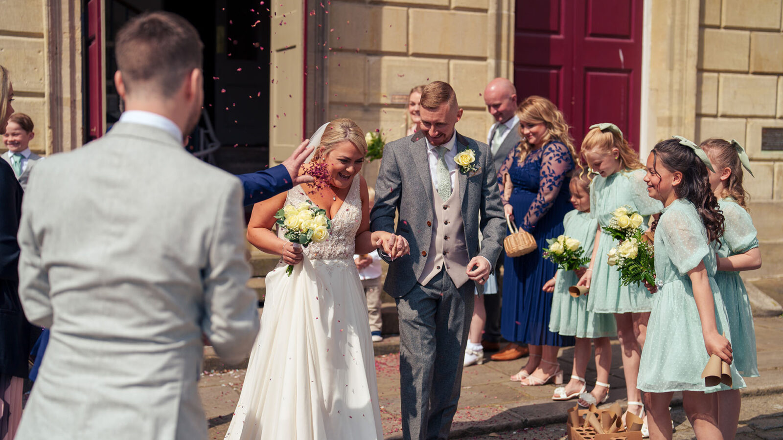 Couple leaving the chapel at Windsor Guildhall after their wedding