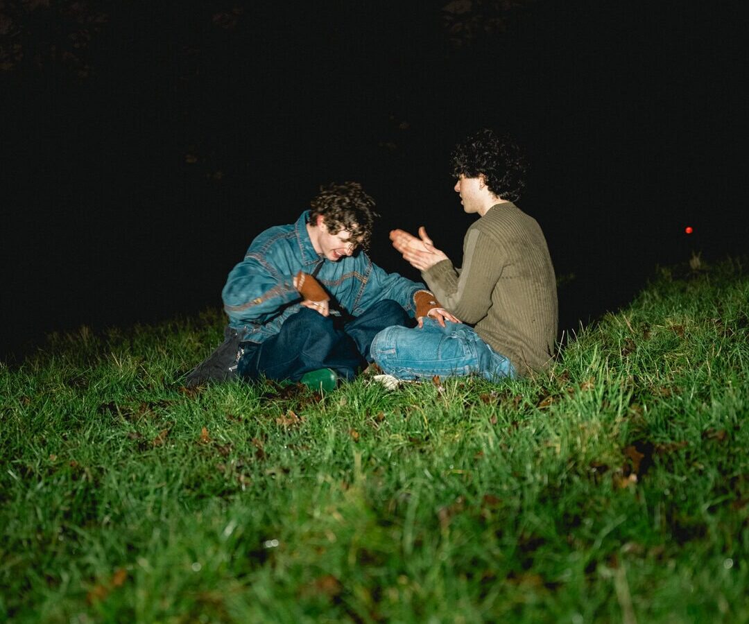 Two people on a hillside, an environmental documentary portrait
