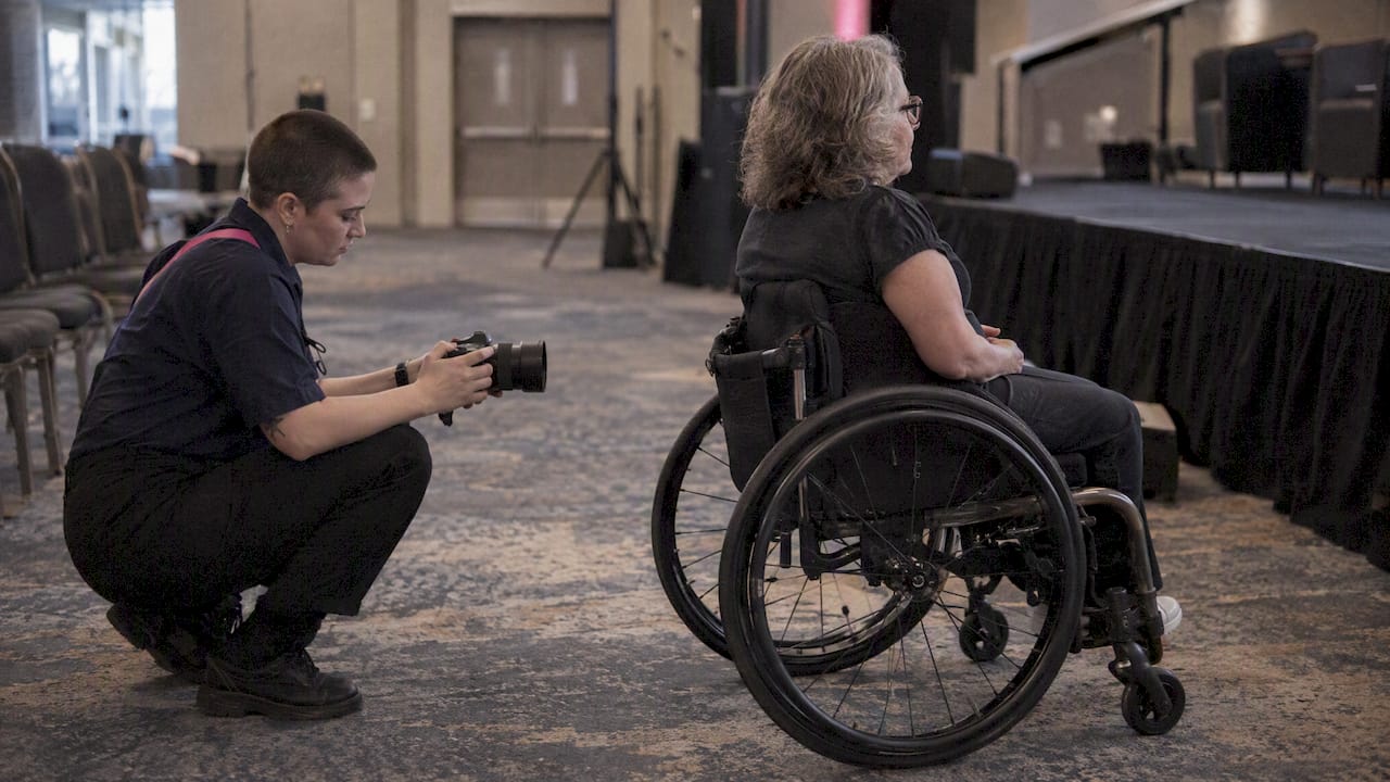 Photographer checking accessible camera position