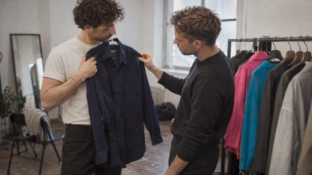 Two actors comparing headshot outfits