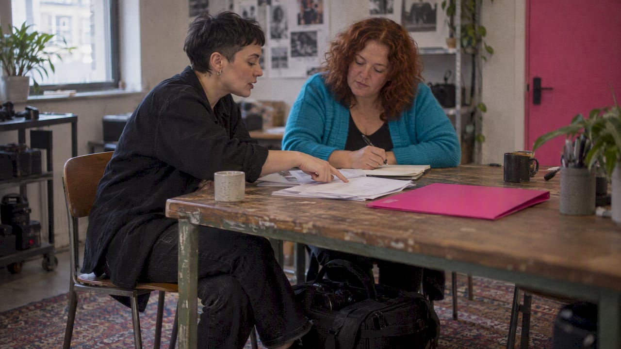 Two women clarifying a photography brief