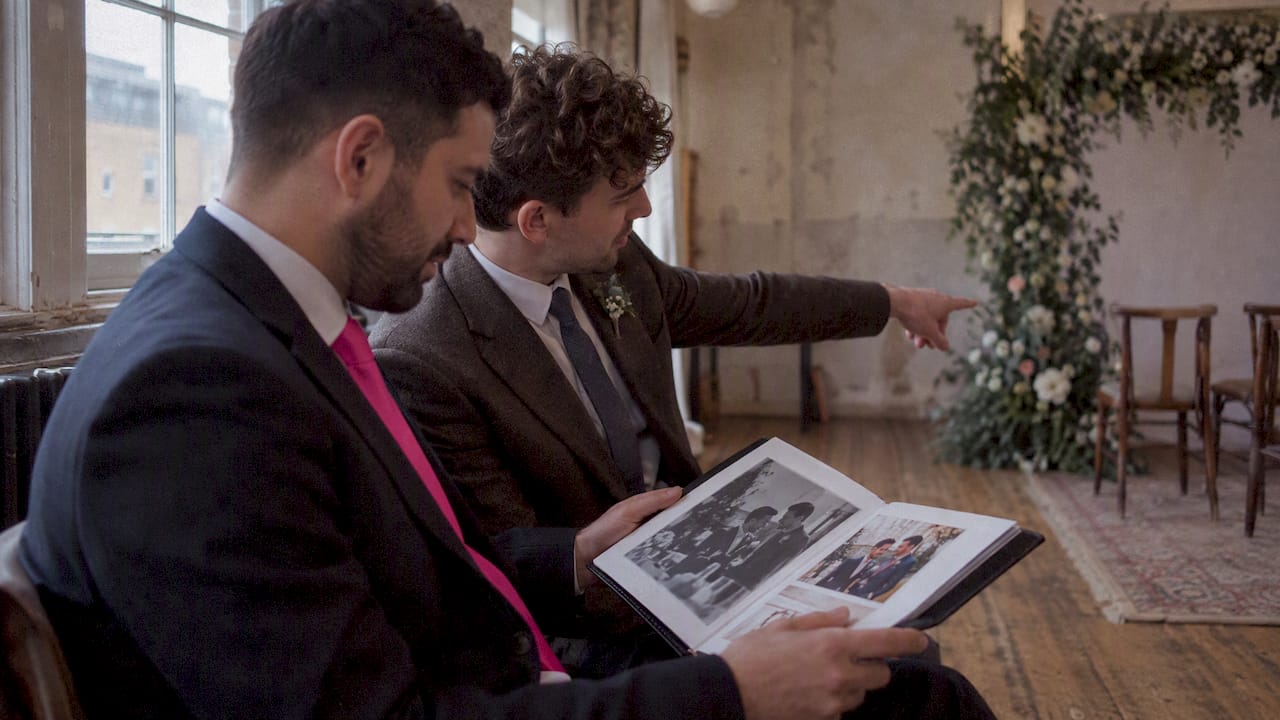 Two men comparing wedding photography styles