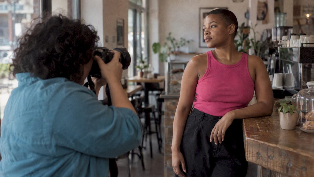 Photographer making a Pride campaign portrait