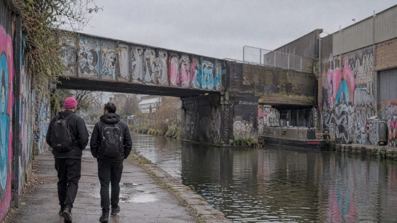 Graffiti-covered bridge beside a Hackney Wick canal